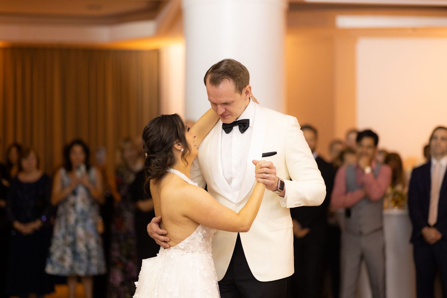 Wedding couple executing graceful dance moves during their reception celebration.