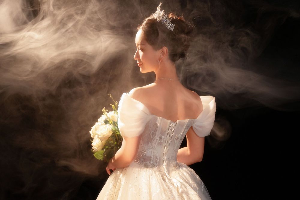 Dramatic light and shadow wedding portrait using a softbox for a moody vintage HK film look, captured by Imagine Image Studio.