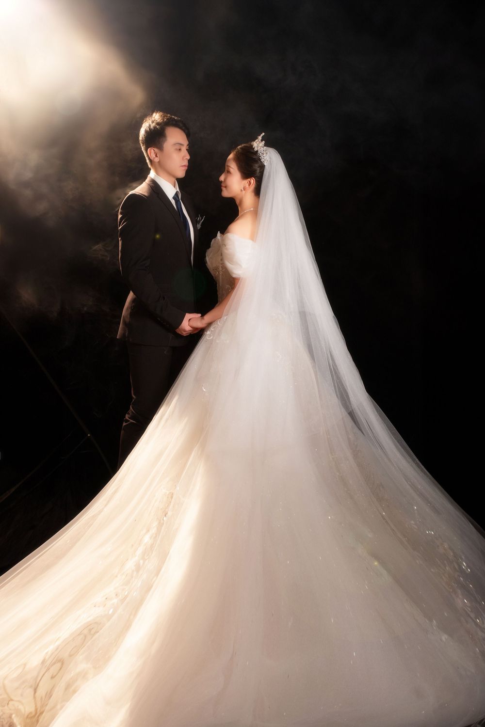 Dramatic light and shadow wedding portrait using a softbox for a moody vintage HK film look, captured by Imagine Image Studio.