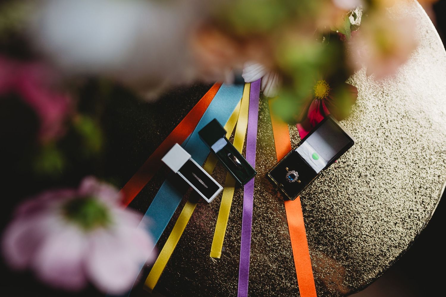 Colorful ribbons attached to wedding decorations in close-up detail shot.