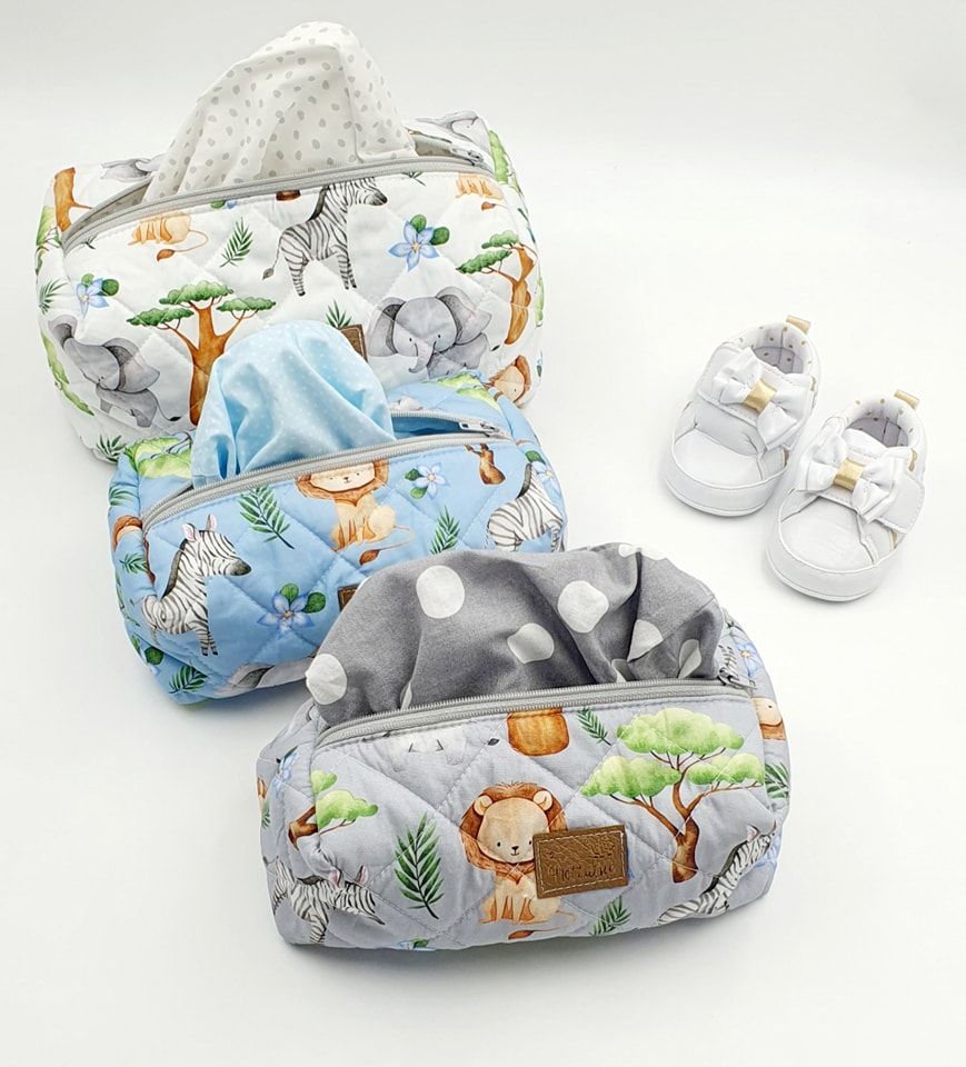 Baby blanket set featuring woodland animal prints with matching white shoes.