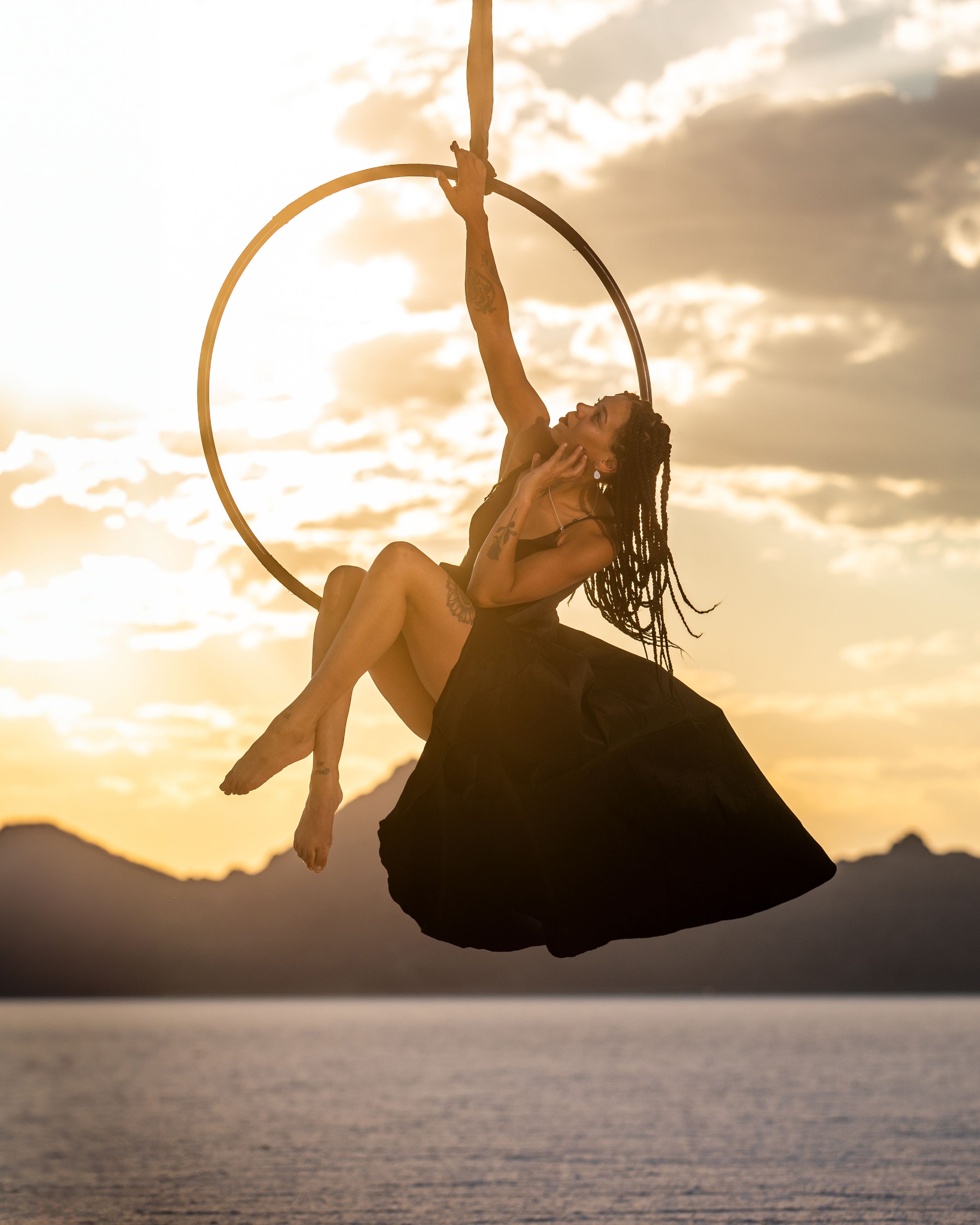 Black aerialist on hoop on Utah Wendover Salt Flats; aerial arts photography and aerial portraits by a professional aerialist photographer.