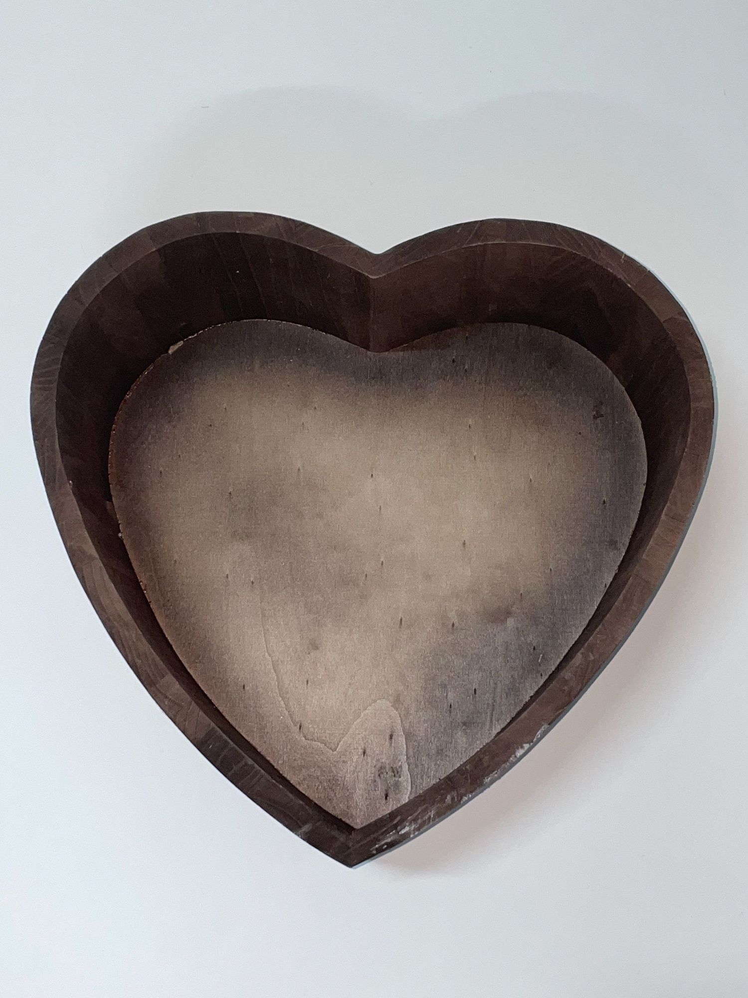 Heart-shaped wooden container or frame shown from multiple angles on white background.