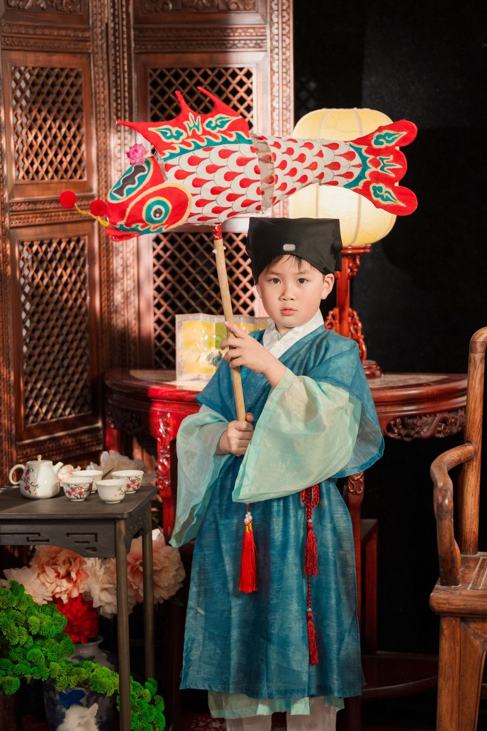 Happy family enjoying cozy home activities in Ming Dynasty Hanfu with soft studio lighting, by Imagine Image Studio Auckland.