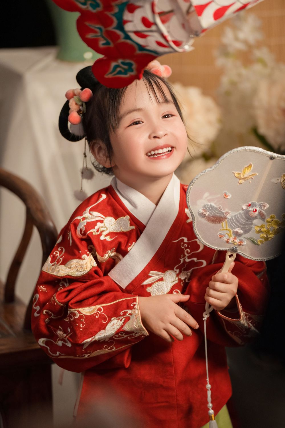 Happy family enjoying cozy home activities in Ming Dynasty Hanfu with soft studio lighting, by Imagine Image Studio Auckland.