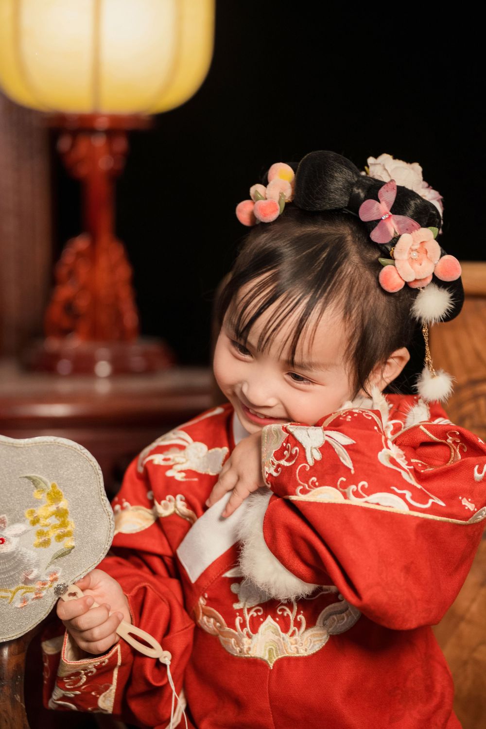 Happy family enjoying cozy home activities in Ming Dynasty Hanfu with soft studio lighting, by Imagine Image Studio Auckland.