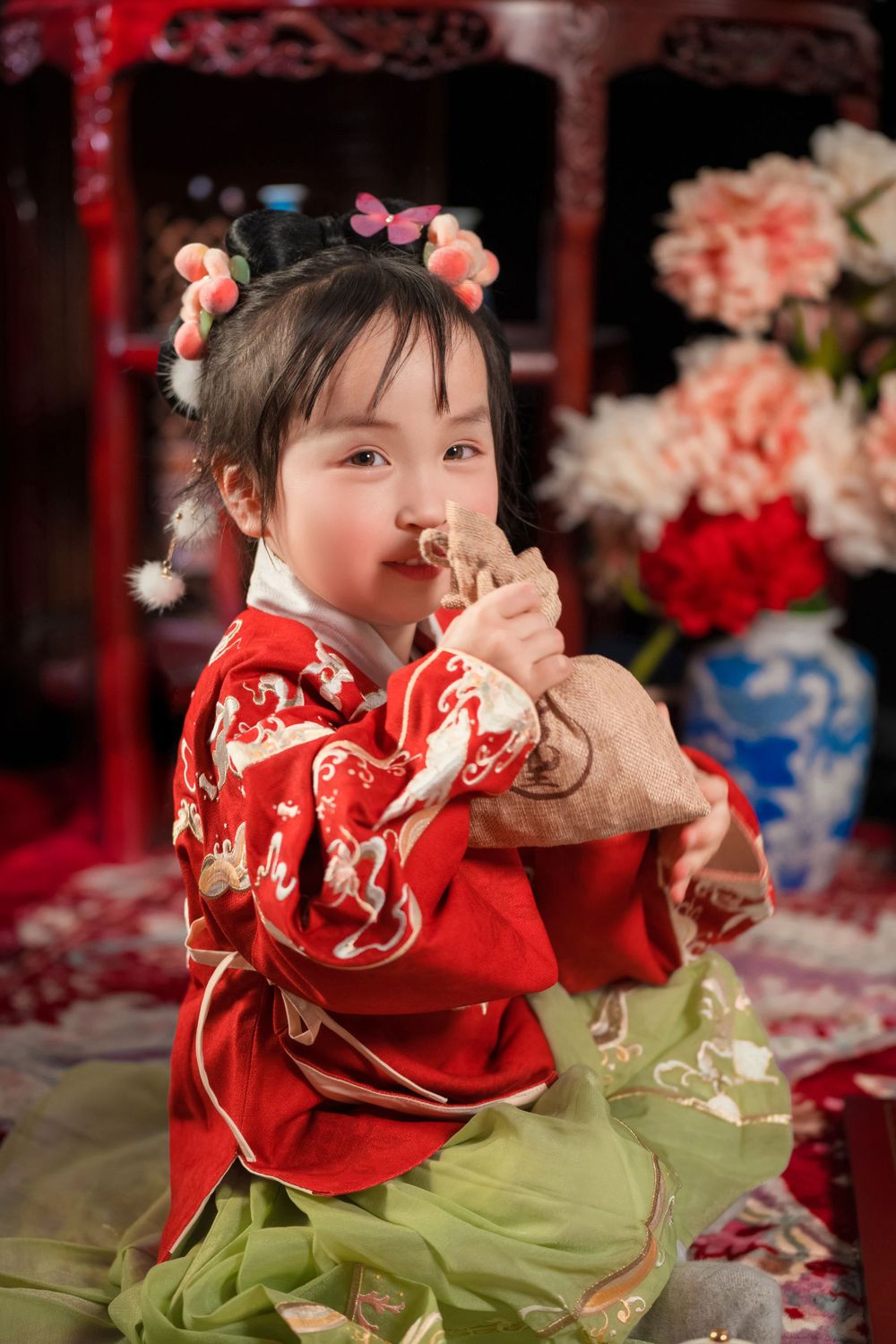 Happy family enjoying cozy home activities in Ming Dynasty Hanfu with soft studio lighting, by Imagine Image Studio Auckland.