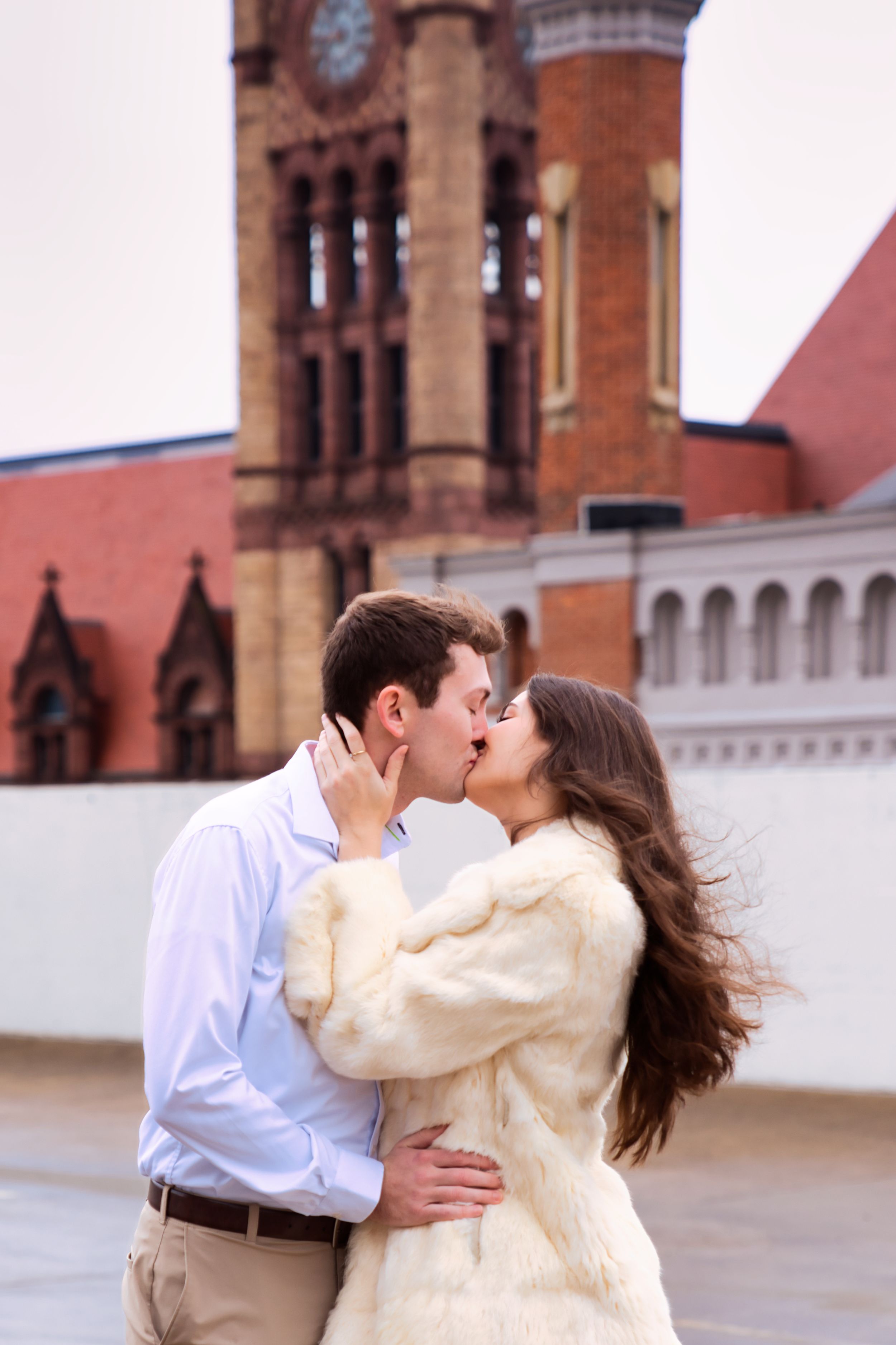 Couple getting engagement photos done in downtown Cincinnati Ohio on a rooftop : Cincinnati Wedding Photographer - Engagement Photographer