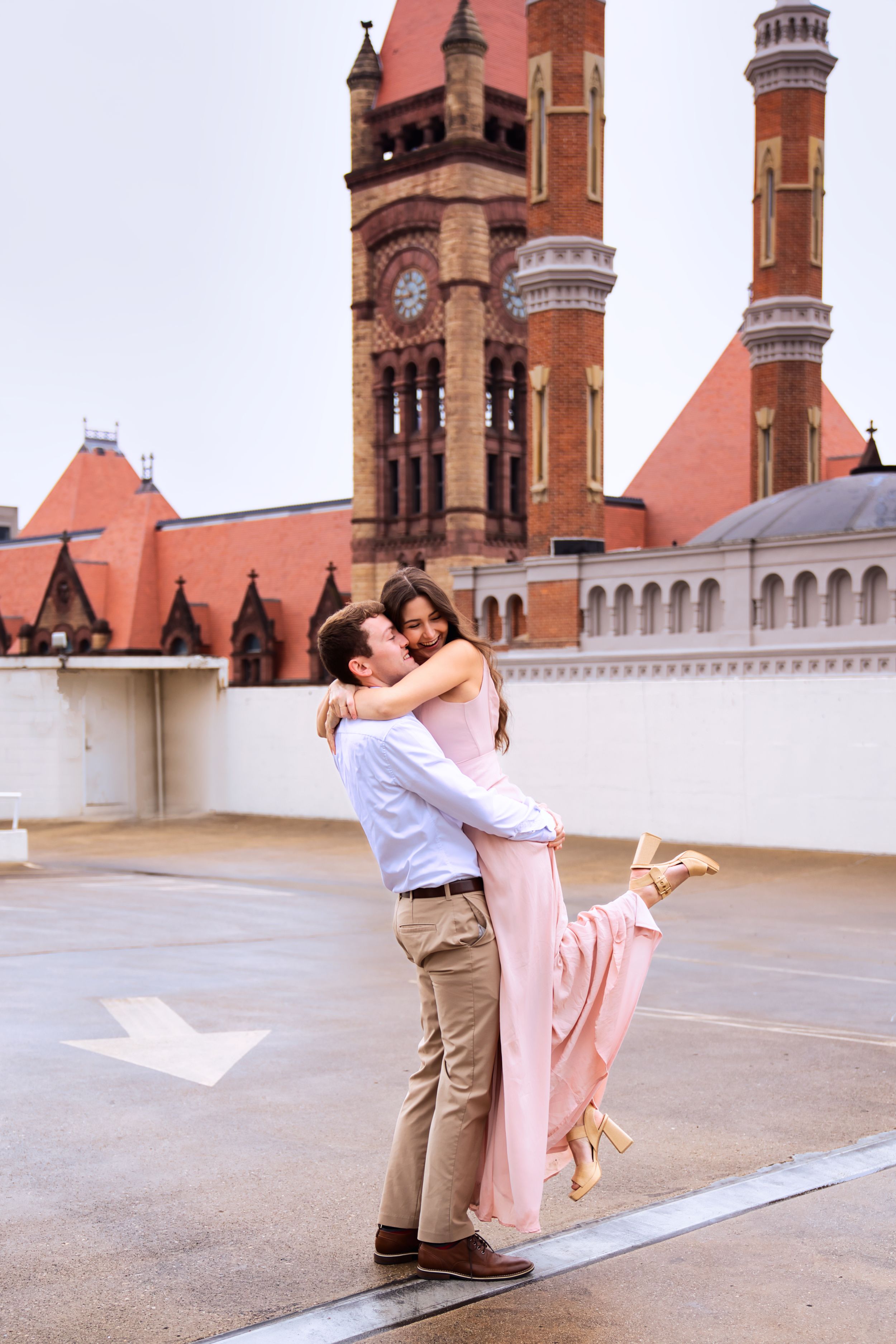 Couple getting engagement photos done in downtown Cincinnati Ohio on a rooftop : Cincinnati Wedding Photographer - Engagement Photographer