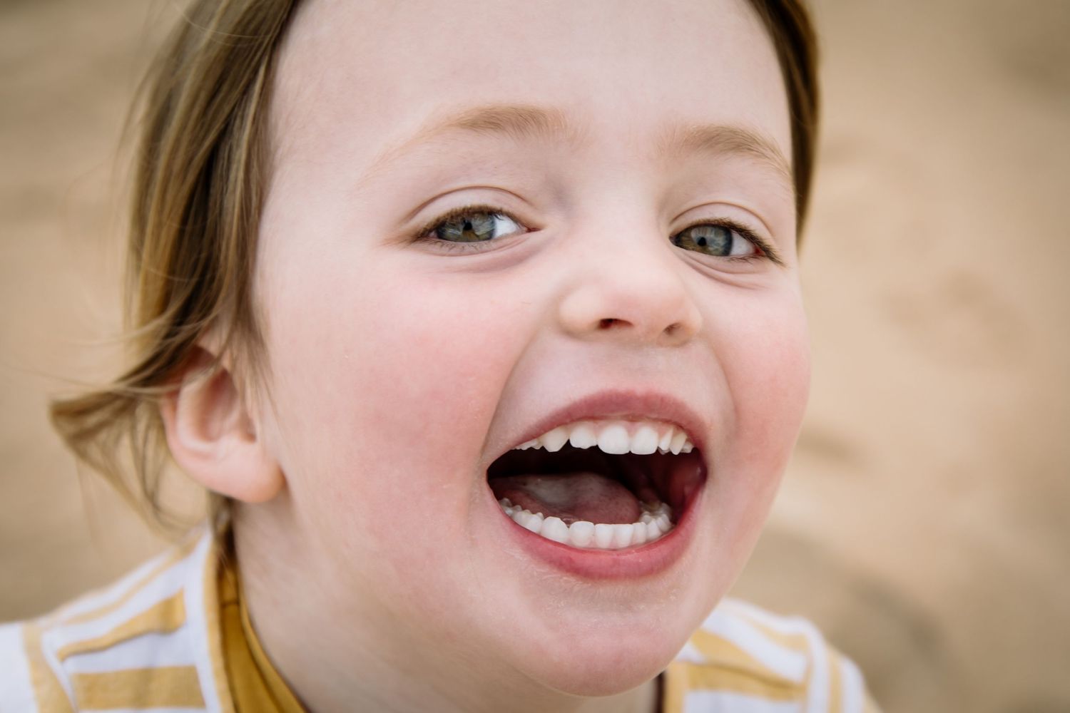 A joyful expression captured in an extreme close-up portrait.