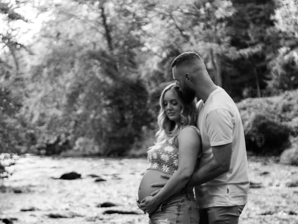 Black and white romantic photo sequence showing couple embracing in an outdoor setting.