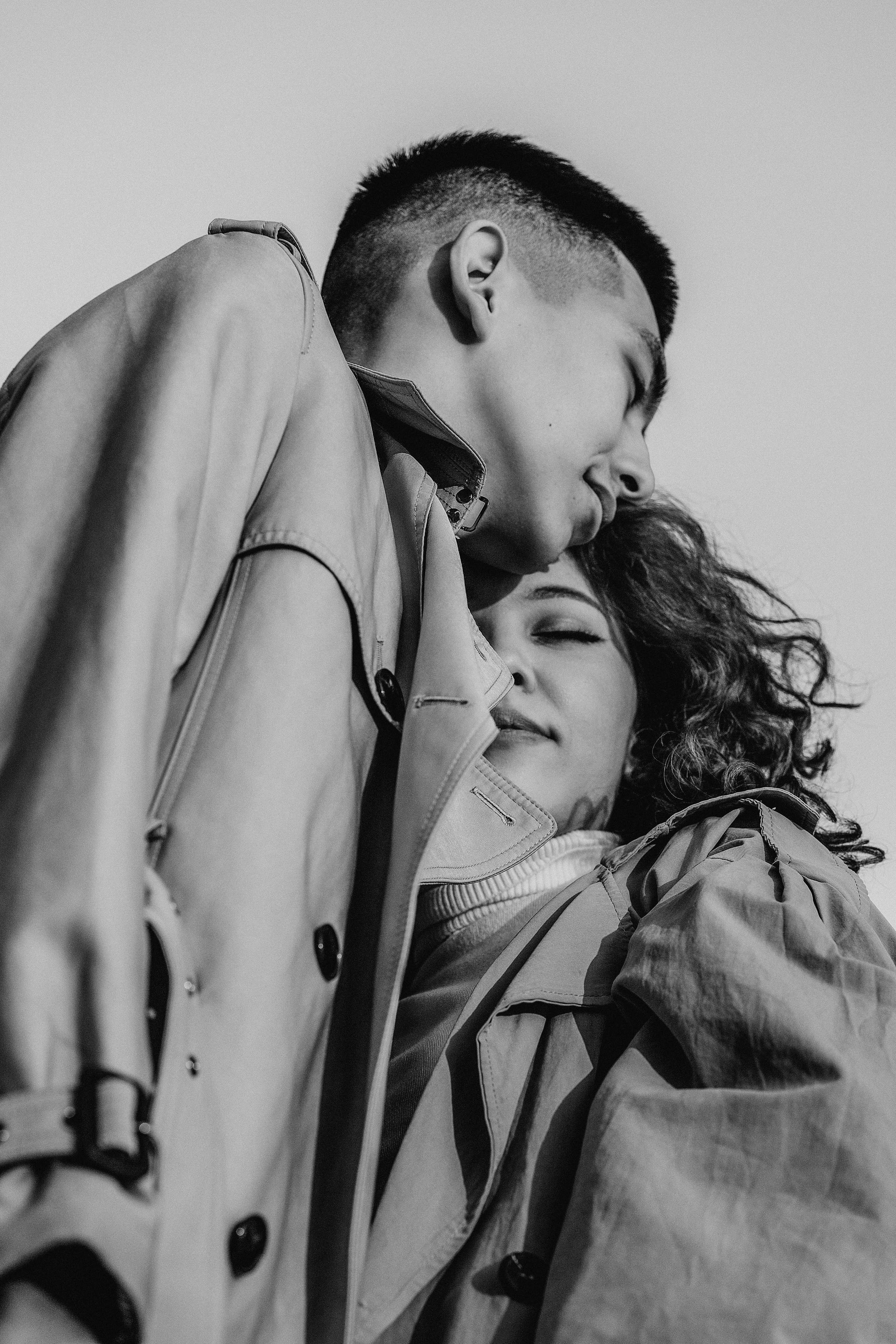 Black and white street photography of a couple in trench coats in Seattle