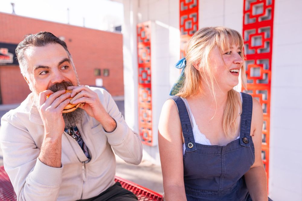 Salt Lake City Utah Photographer, candid relaxed couple on a date night at a drive through diner in sugar house with burgers and fries