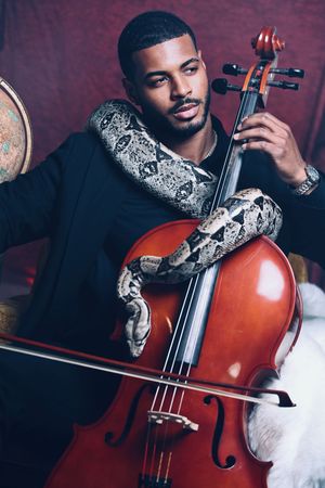Fine Art Portrait of Professional Cellist The Cello Guy with exotic snake by Marley Domeck