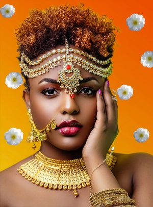 Creative beauty portrait of Nakashima wearing vibrant makeup and a gold headpiece during an editorial fashion photoshoot by Marley Domeck.