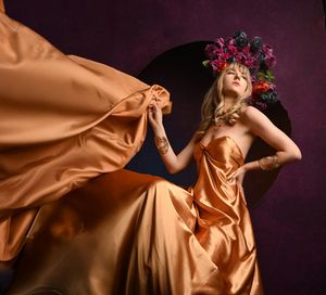High Fashion Editorial Portrait in Flowing Gold Couture by Marley Domeck