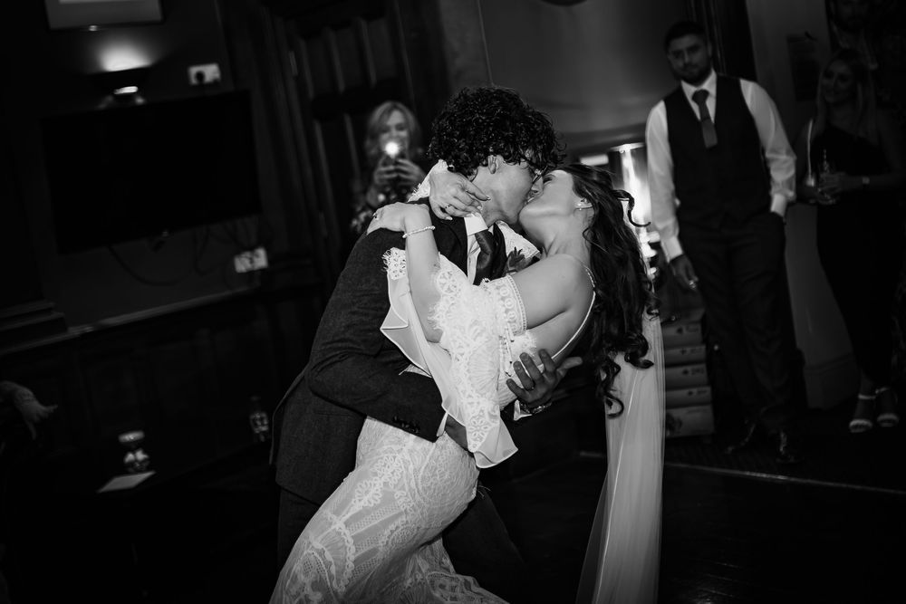 A black and white photo montage shows intimate wedding moments including dancing and embracing couples at a reception.