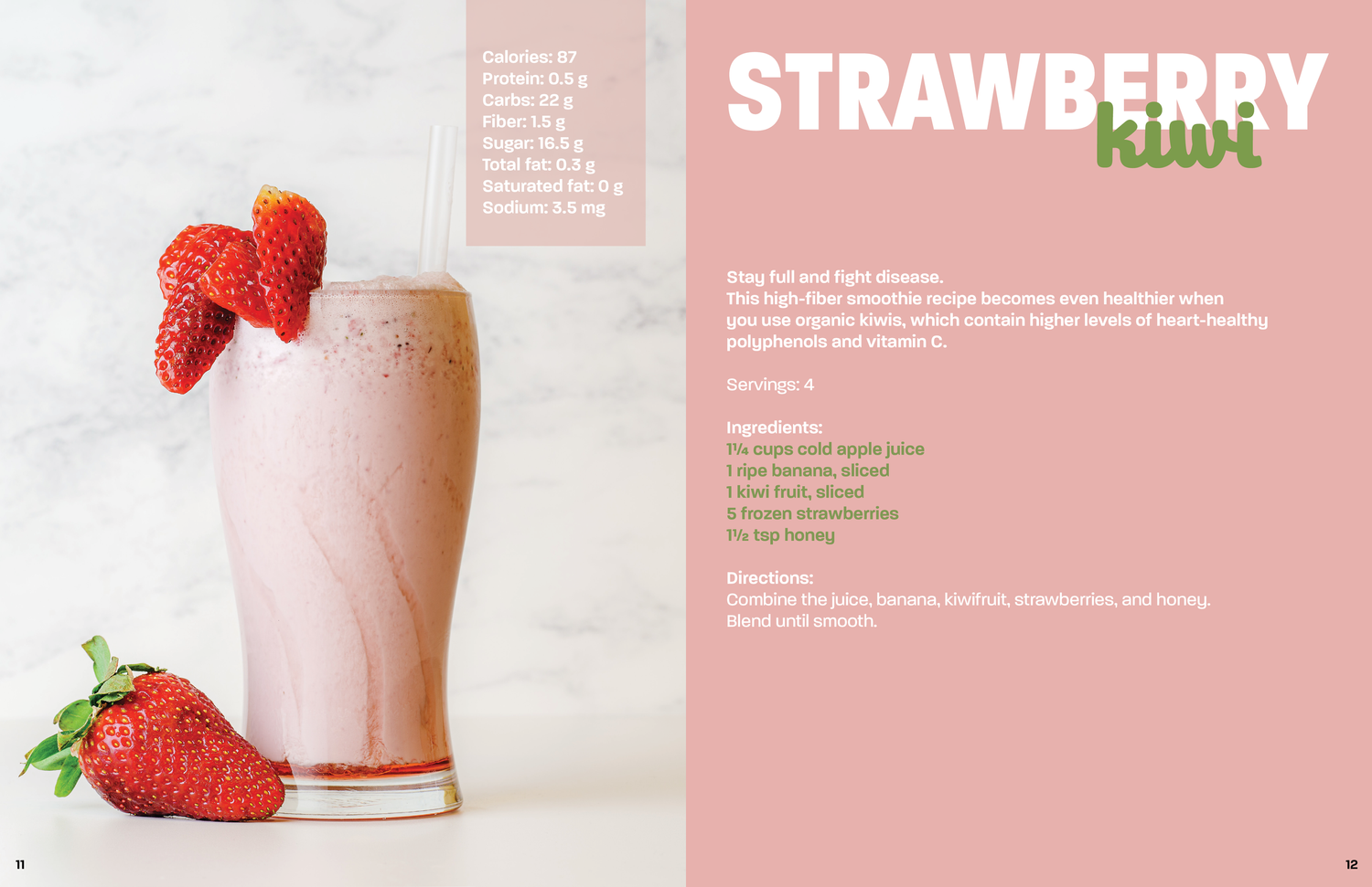 Pink strawberry smoothie with fresh strawberries in a tall glass against a pink recipe book background.