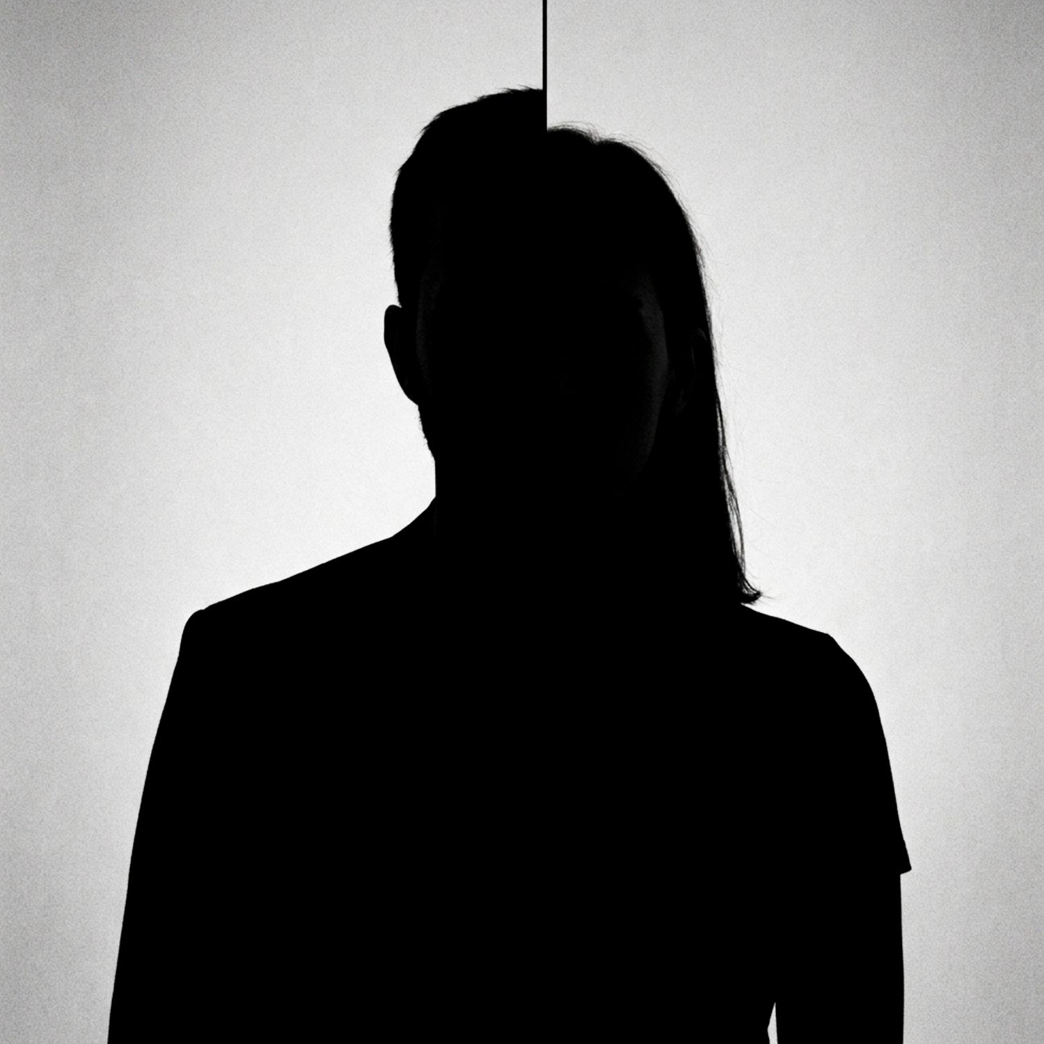 Silhouette of a woman with long hair against a split light background.