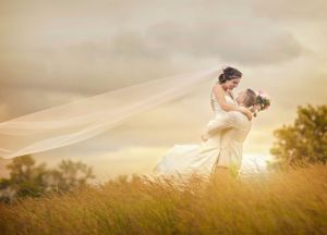 Saratoga National Golf Club in Saratoga Springs NY wedding venue. Bride and groom in field during sunset
