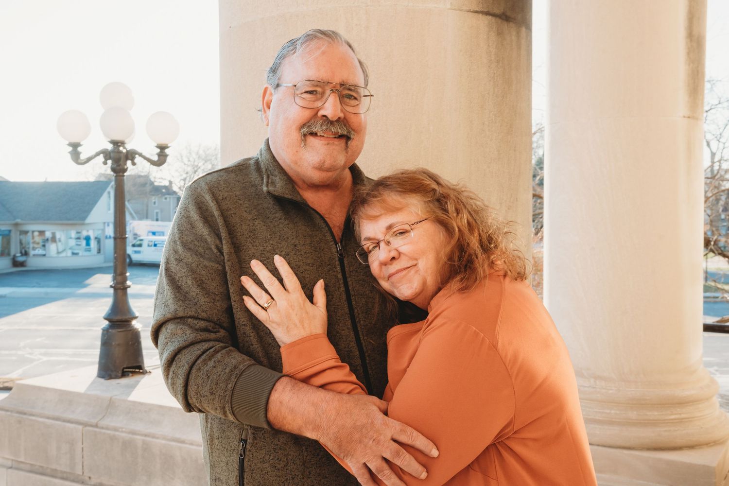 Portrait of photographer's father and step-mother hugging. Doughman Photography.
