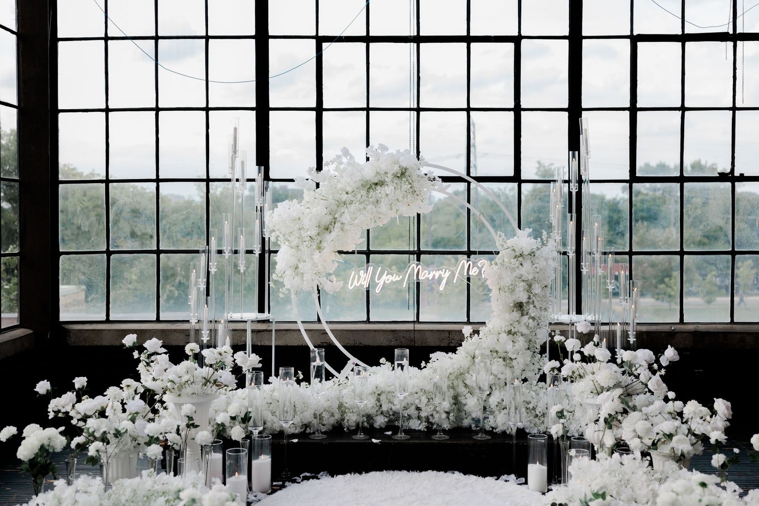 Luxury proposal planner creating romantic engagement decor