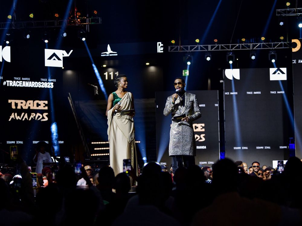 Stage performance at the Trace Awards with dramatic lighting and crowd in foreground.