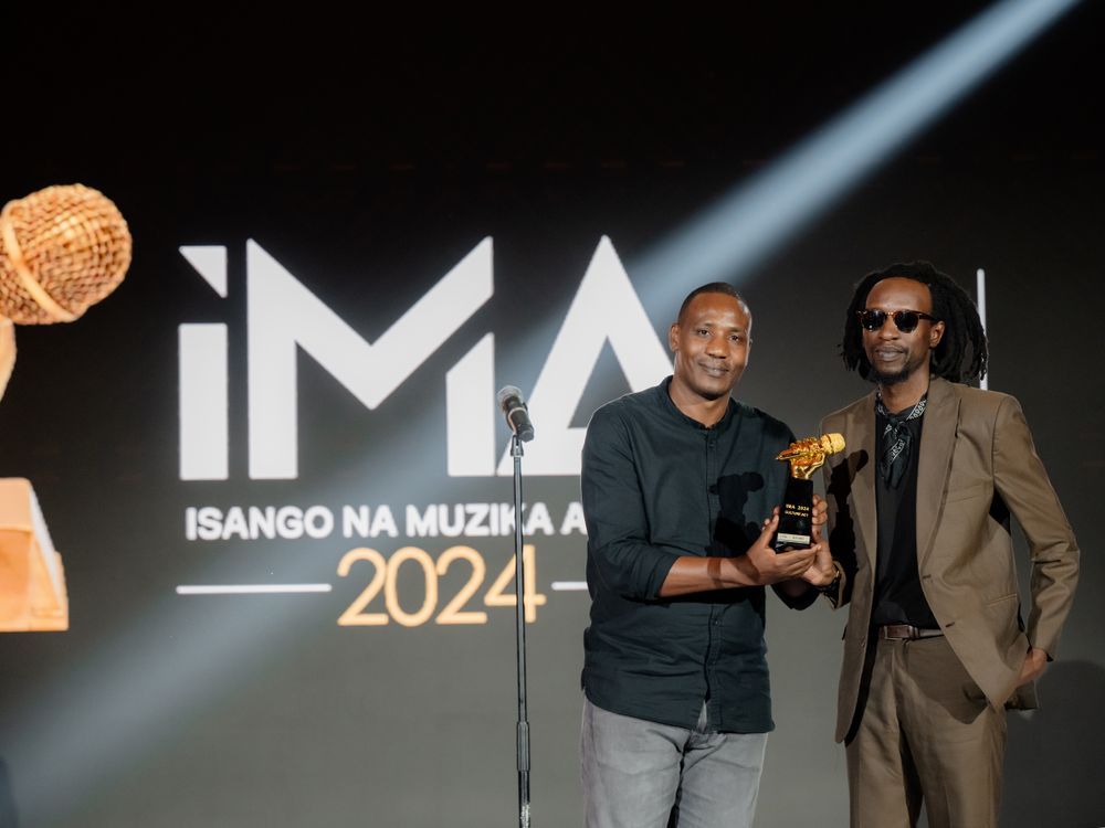 Two award recipients pose with trophy at IMA 2024 Awards ceremony.