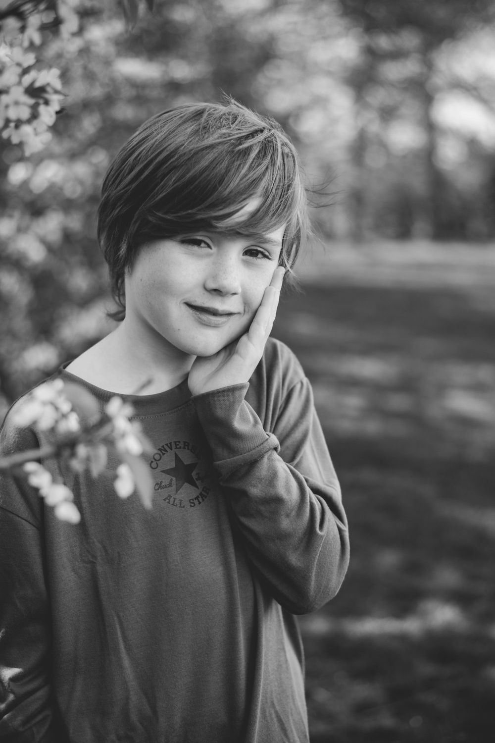 Black and white close-up portrait with gentle natural lighting.