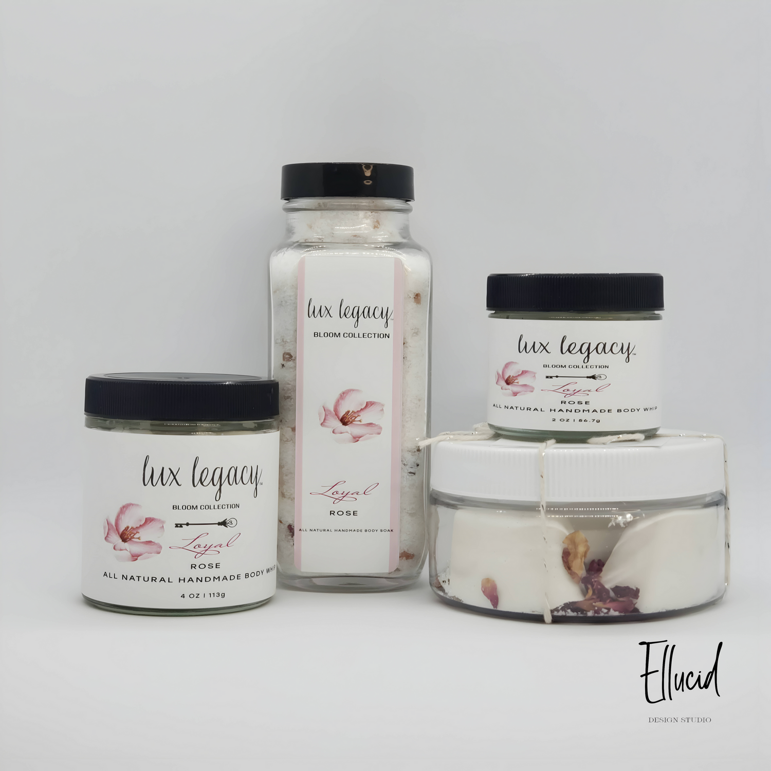 Collection of Lux Legacy branded beauty products in varying sizes with floral design.