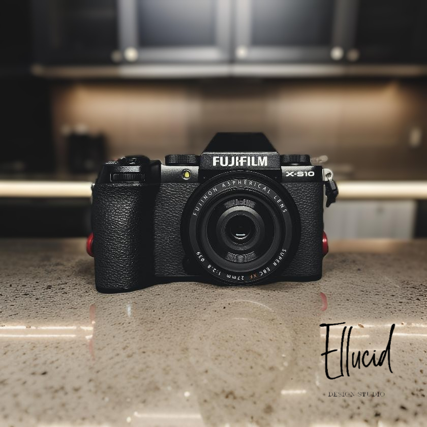 A black Fujifilm X-T30 II digital camera sits on a gray countertop with under-cabinet lighting in the background.