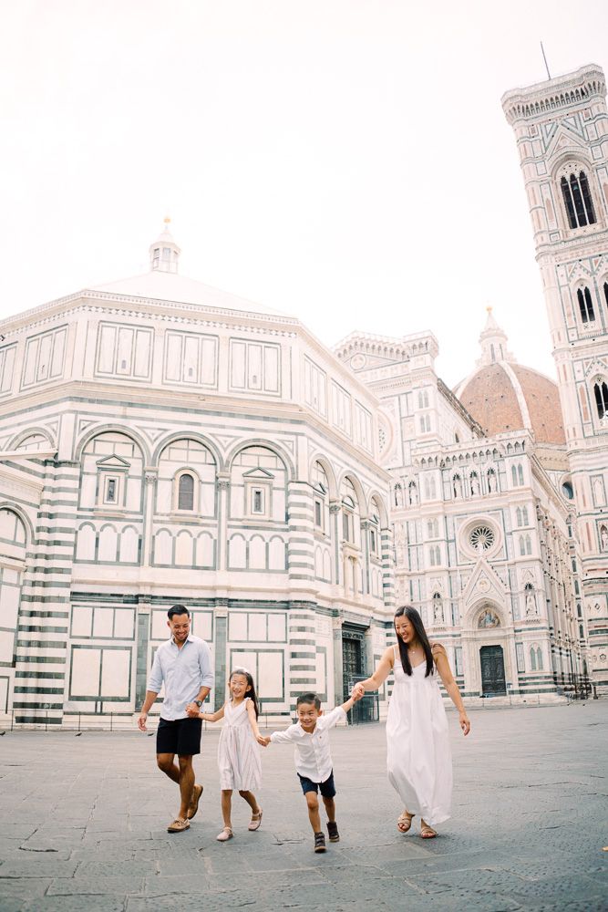 family walking in florence piazza duomo at dawn