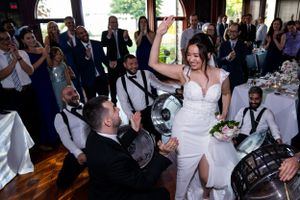 Wedding reception celebration with live band entertainment and dancing.