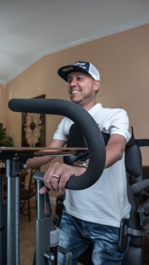 Close-up of padded exercise equipment handle being used during workout session.
