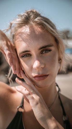 Sun-kissed closeup portrait with natural lighting at beach location.