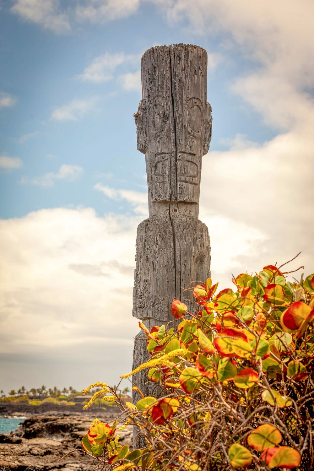 one of the ki'i that survived a catastrophic tsunami on a lava beach in the Kona Village resort on the big island of Hawaii