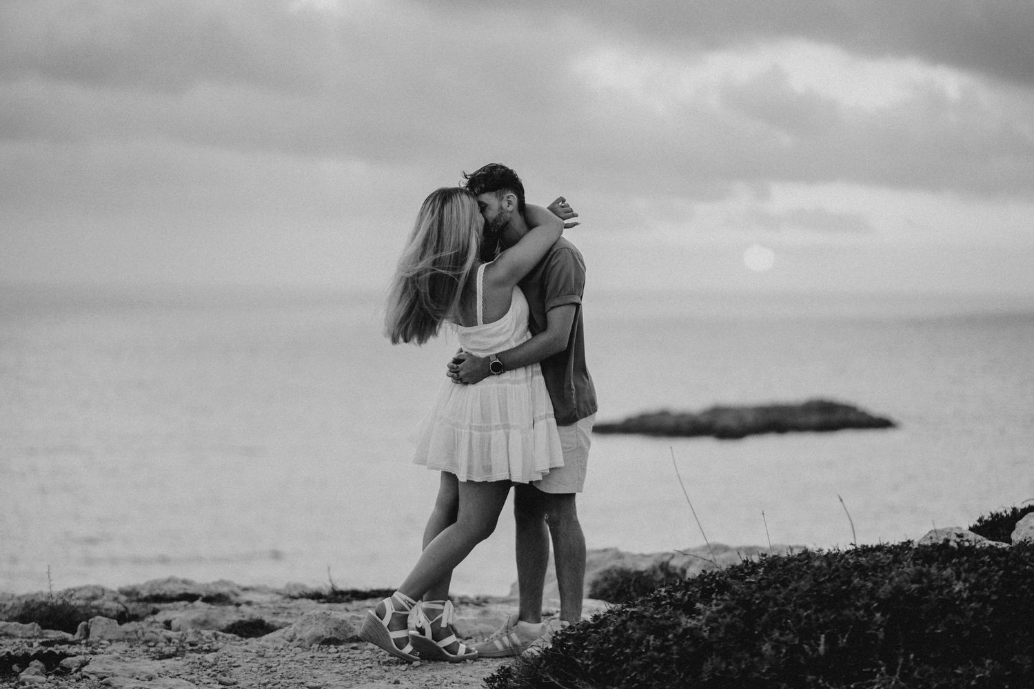 Black and white romantic couple portrait on a rural path.