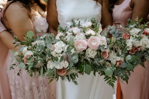 Group of bridesmaids holding florals. Samantha Bateman wedding photography.