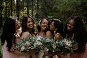 Group of girls laughing, bridesmaids laughing. Samantha Bateman wedding photography.