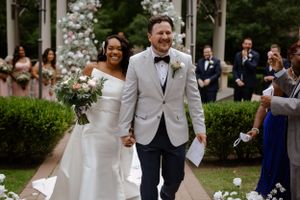 Couple walking down aisle in wedding, photography by Samantha Bateman