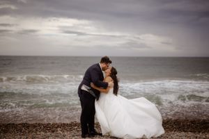 Cape Breton wedding photography, Bride walking in ocean. Wedding photography by Samantha Bateman.