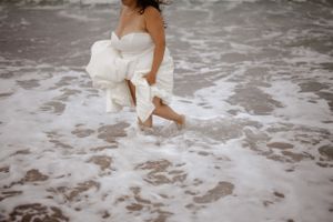 Cape Breton wedding photography, Bride walking in ocean. Wedding photography by Samantha Bateman.