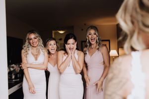 First look with bridesmaids. Wedding photography by Samantha Bateman.
