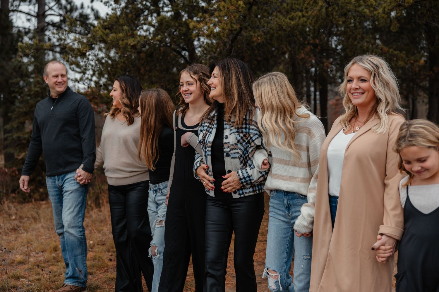 Excited family poses for extended family photoshoot in Bemidji Minnesota