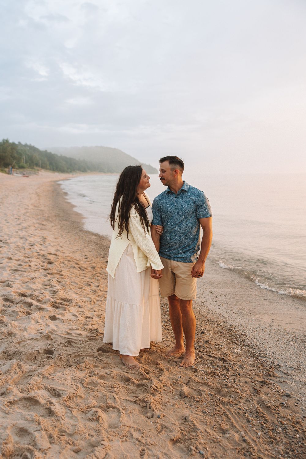 Romantic beach engagement shoot at sunset—Traverse City couples photography.