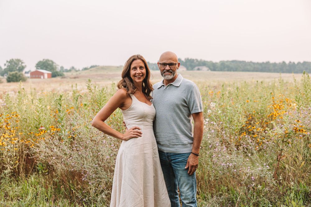 Golden hour couple portrait in grassy field—Utah engagement photography.