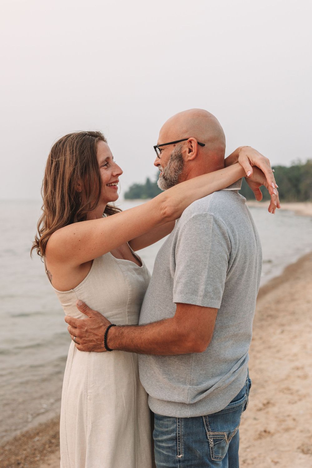 Sunset engagement photo on Lake Michigan beach—Carson Suttle Photography