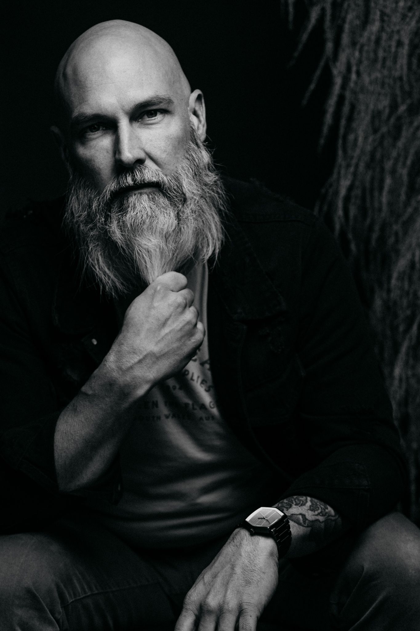 Artistic black and white headshots capturing thoughtful expressions in dramatic shadows.