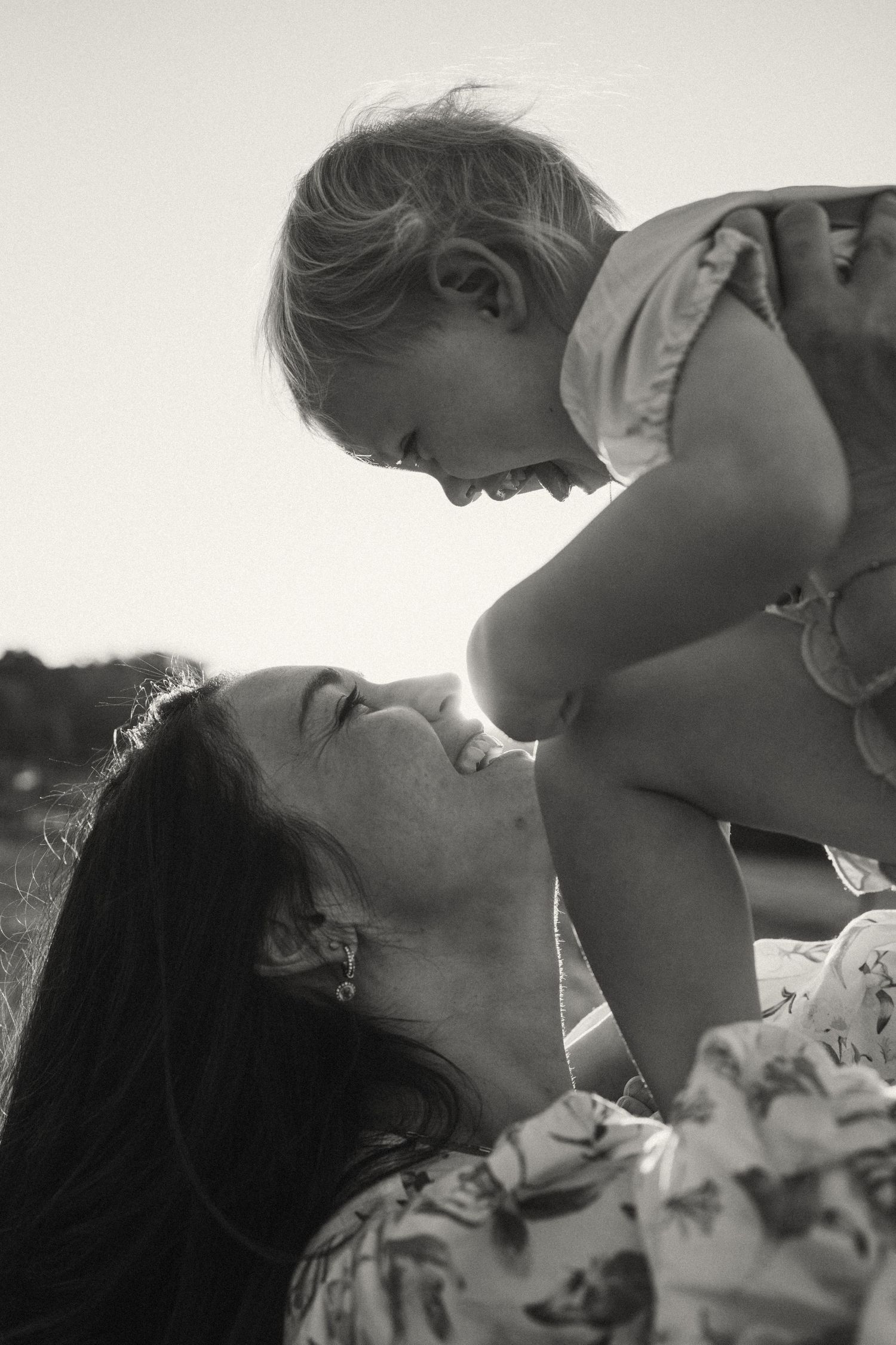A tender moment shared between two people in black and white photography.