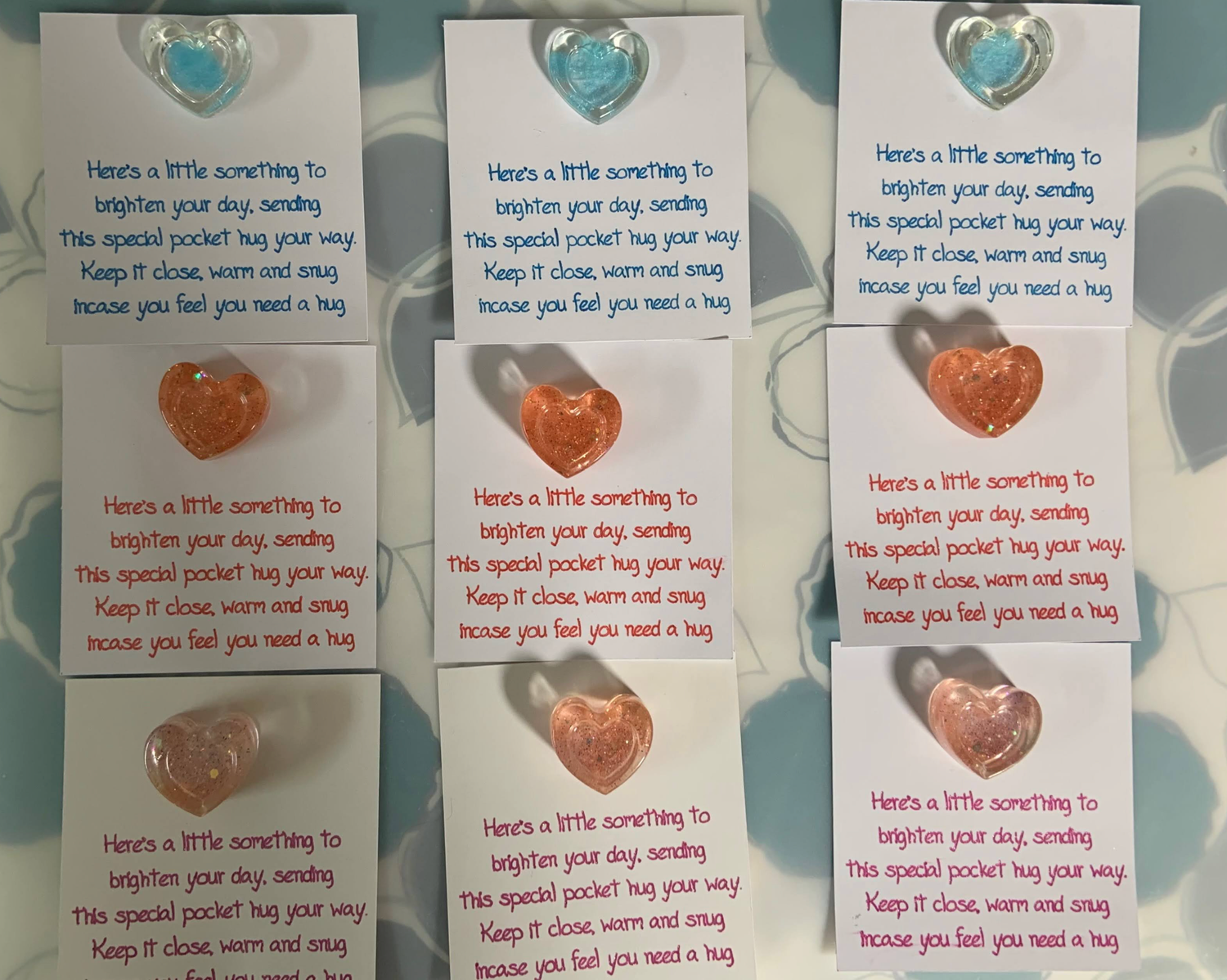 small cards with a pocket hug verse with an attached resin heart